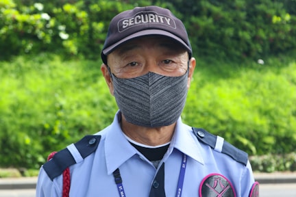 a man wearing a hat and a uniform