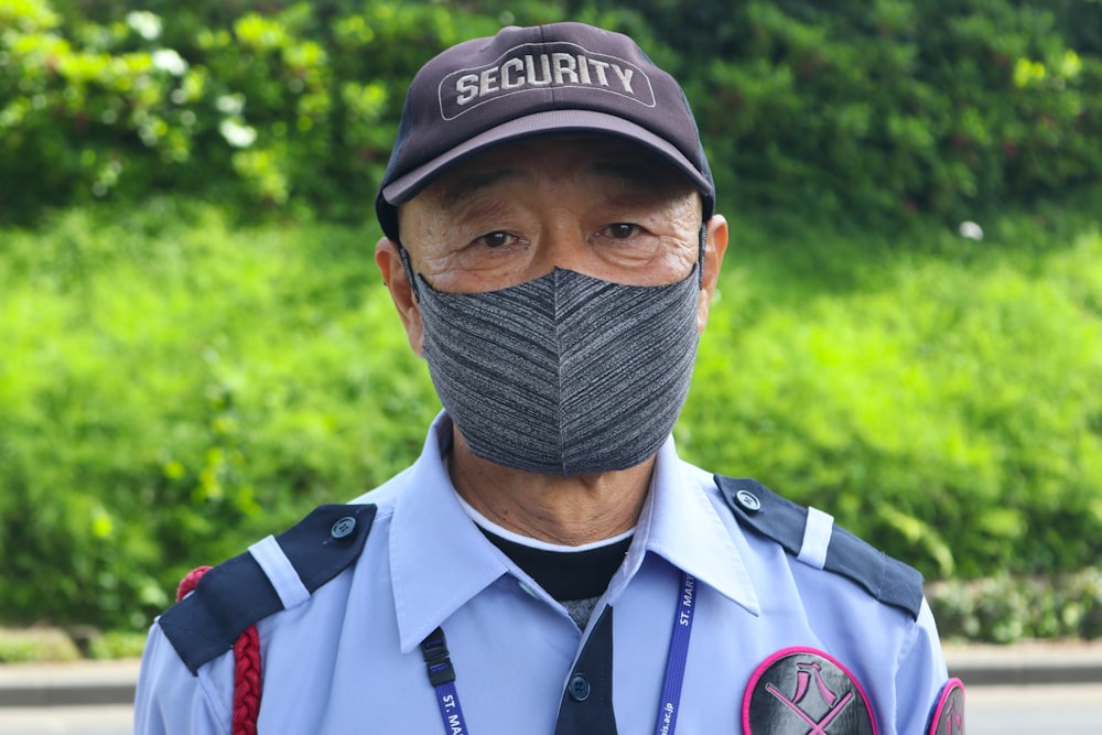 a man wearing a hat and a uniform