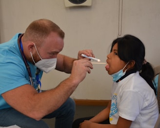 a doctor checking a patient's blood pressure