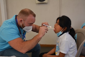 a doctor checking a patient's blood pressure