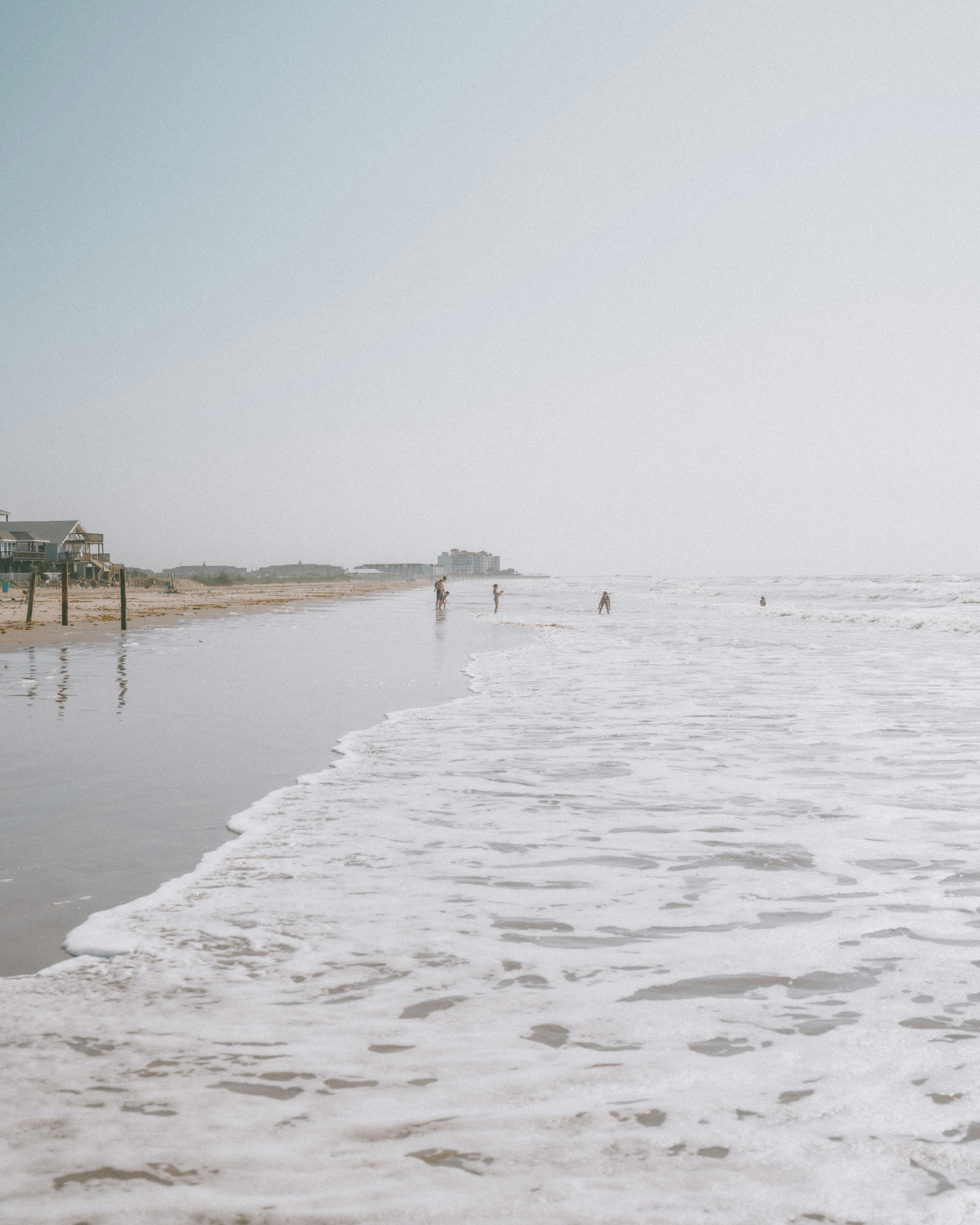 People walking on a beach photo – Free Galveston Image on Unsplash