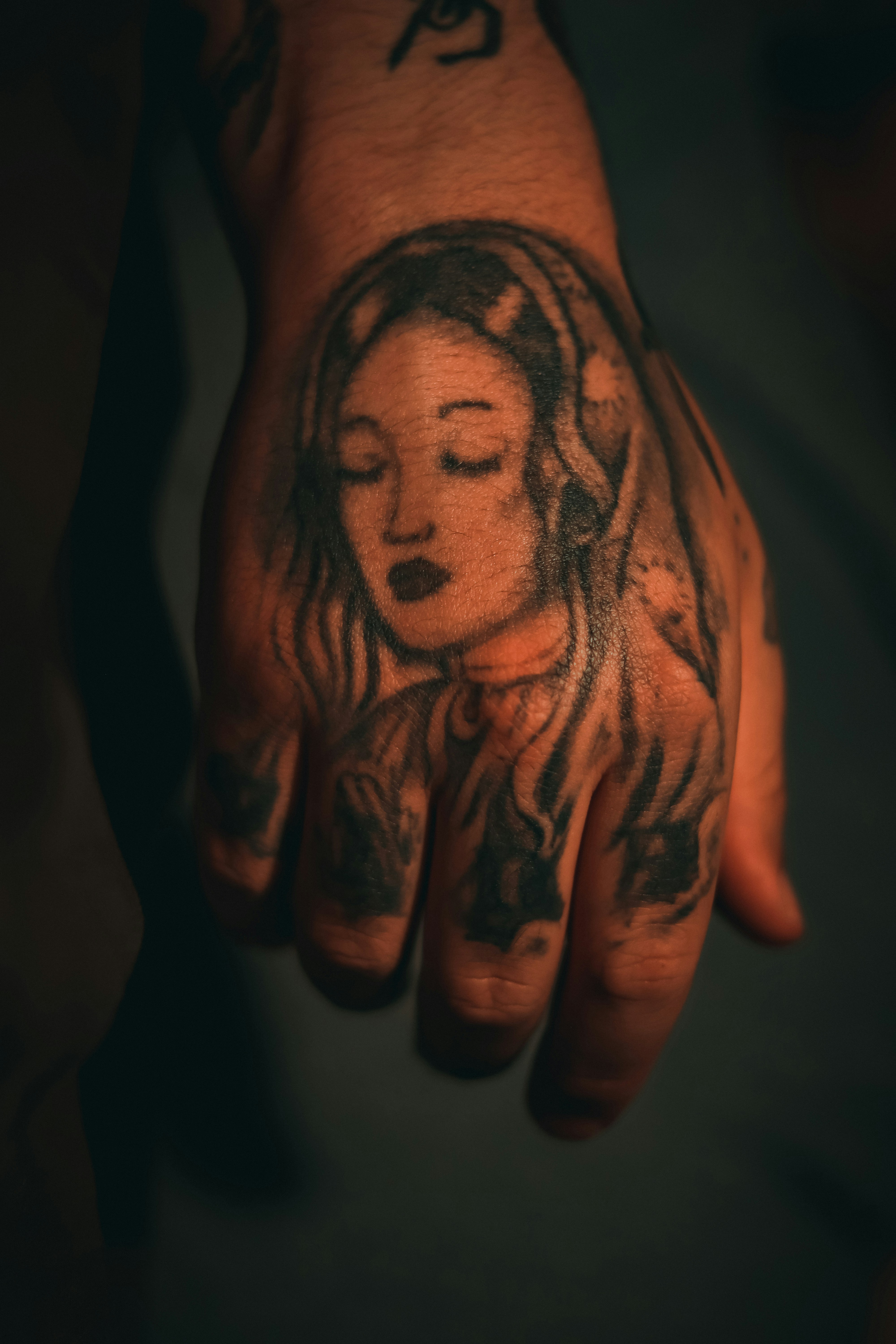 a person's arm with tattoos