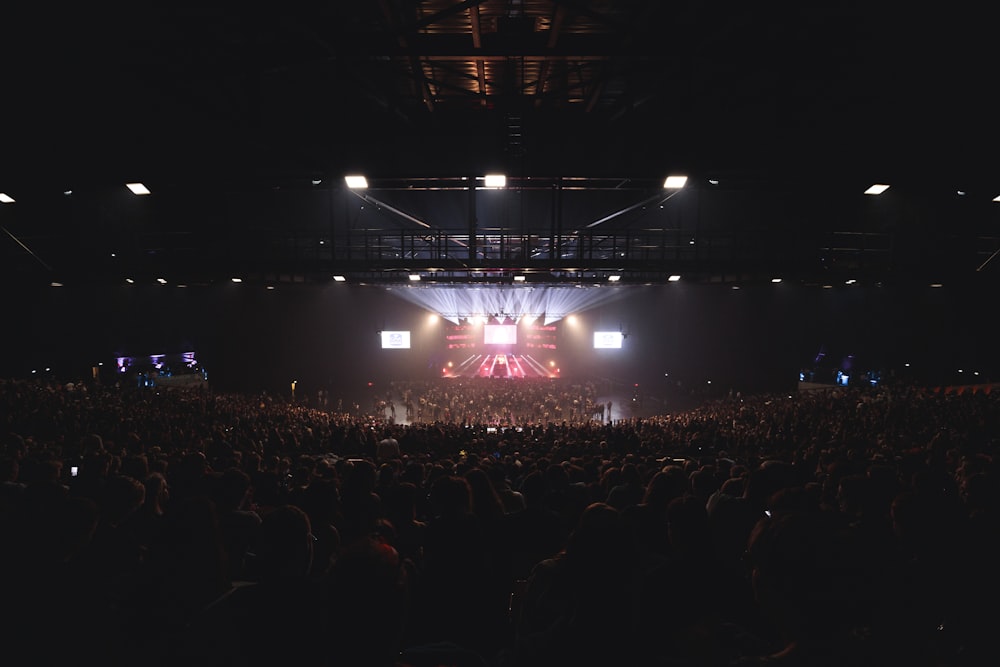 a large crowd of people in a concert hall