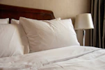 a bed with a lamp on it