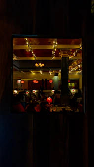 The luxurious interior of the restaurant featuring plush seating and warm lighting.