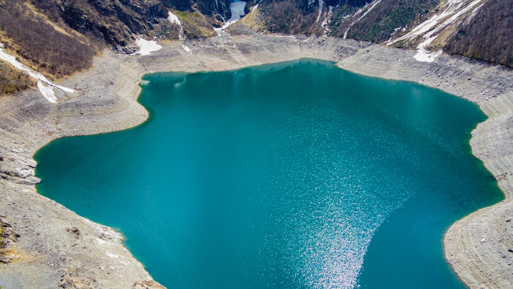 a body of water surrounded by mountains