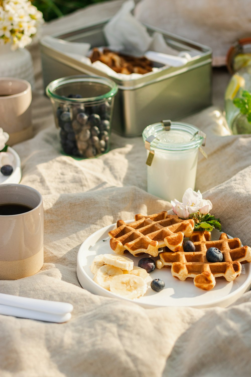 a plate of waffles and coffee