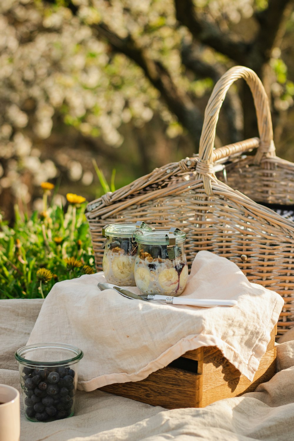 a basket with a basket and jars of food on a table