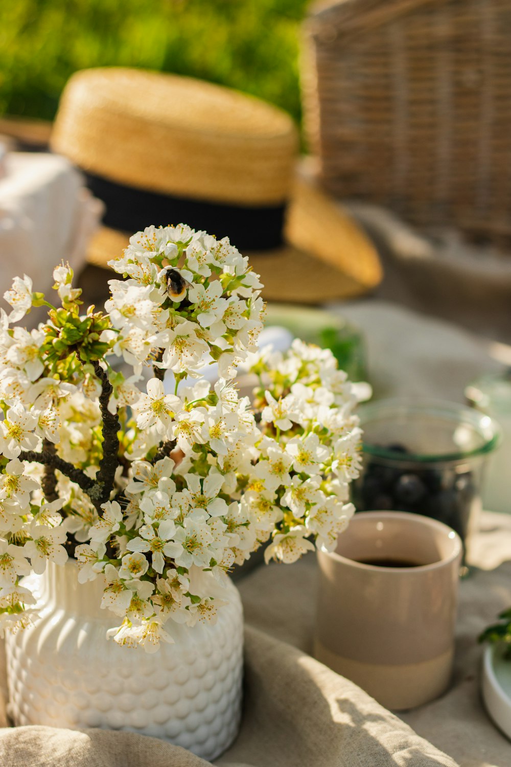 a vase with white flowers