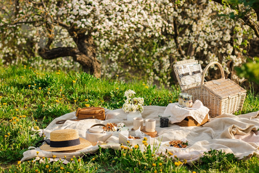 a picnic table with a basket and flowers