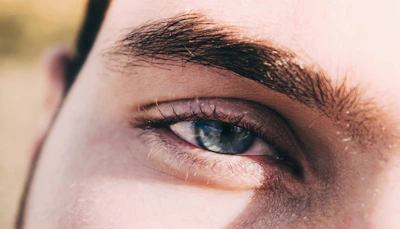Before and after photos showing natural-looking eyebrows enhanced by the nano brown technique.