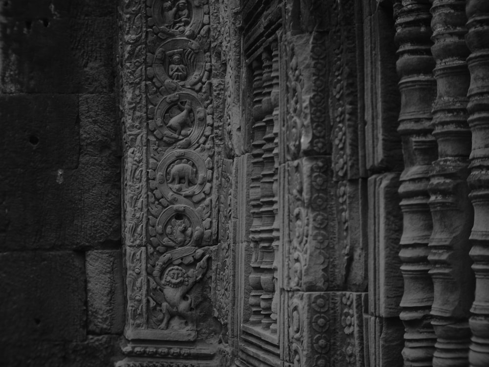 a stone wall with carvings