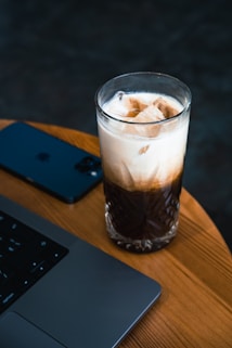a glass of liquid on a table