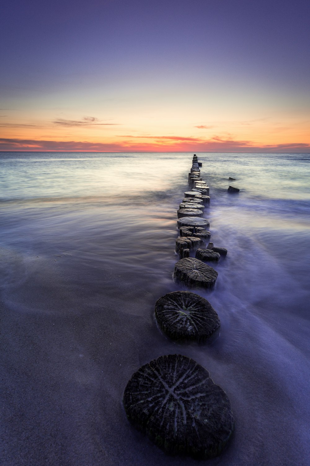 a group of rocks on a beach