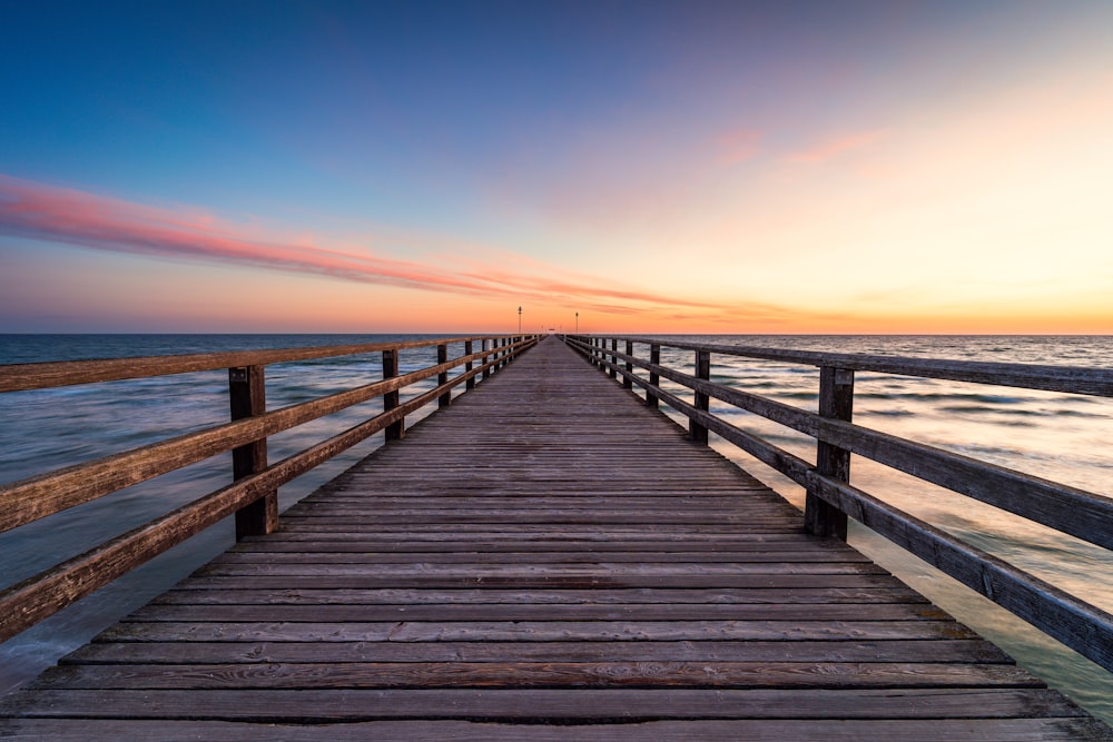 a wooden walkway over water