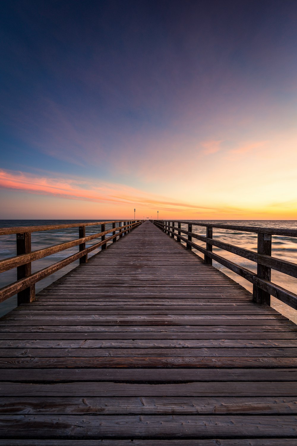 a wooden walkway over water