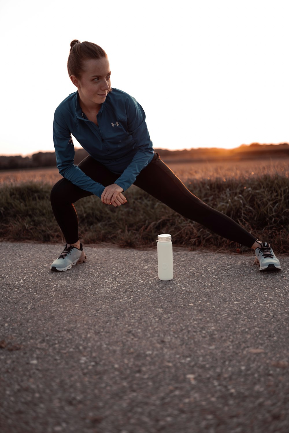 a person kneeling on the ground