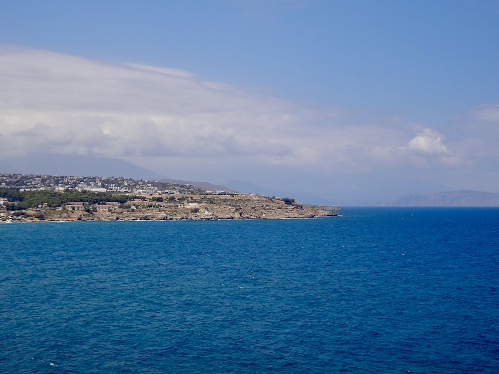 a body of water with land in the distance