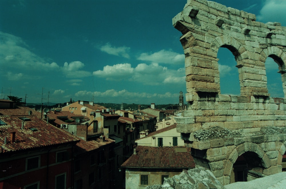 a stone tower with a city below