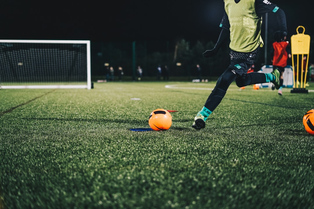 a football player kicking a ball