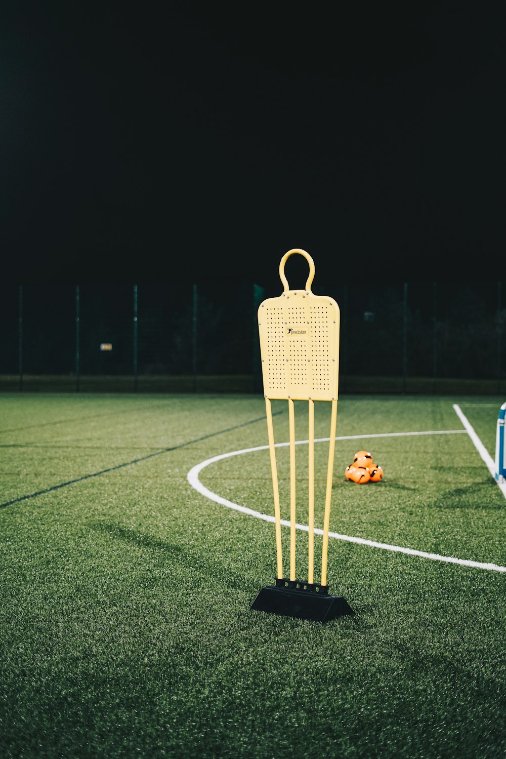 a yellow sign on a football field