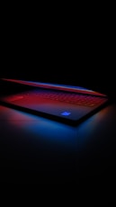 a laptop with a red light