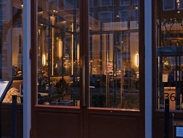 An inviting interior view of sirinda restaurant showing warm lighting and a cozy, stylish dining setting.