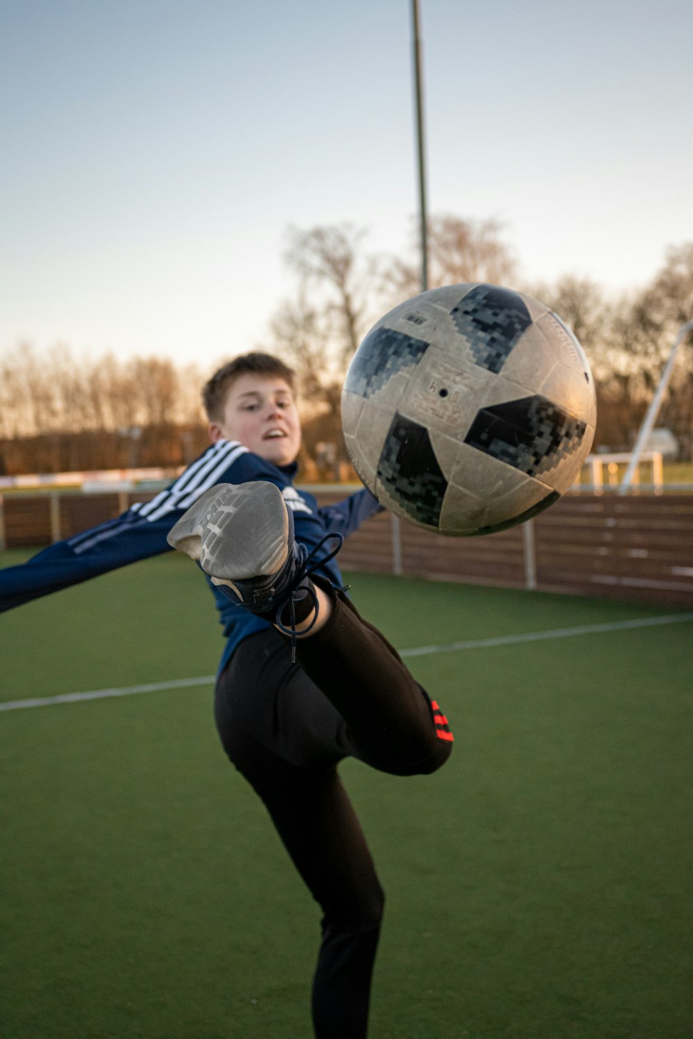 a woman holding a football ball