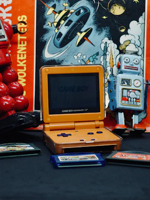 A vintage handheld gaming setup with the Game Boy Advance SP and classic game cartridges.