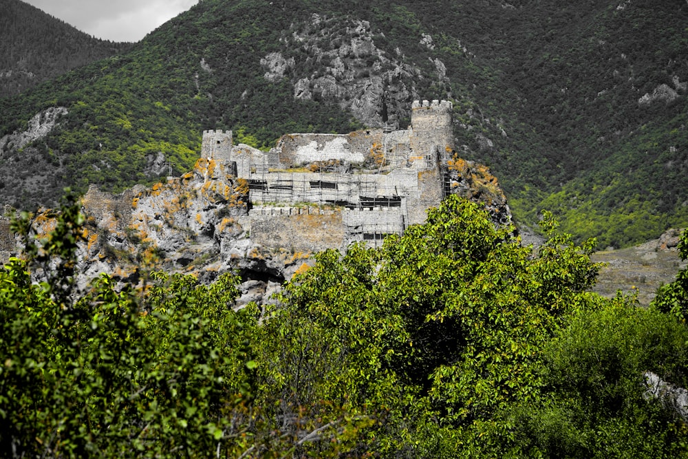 a stone building on a cliff