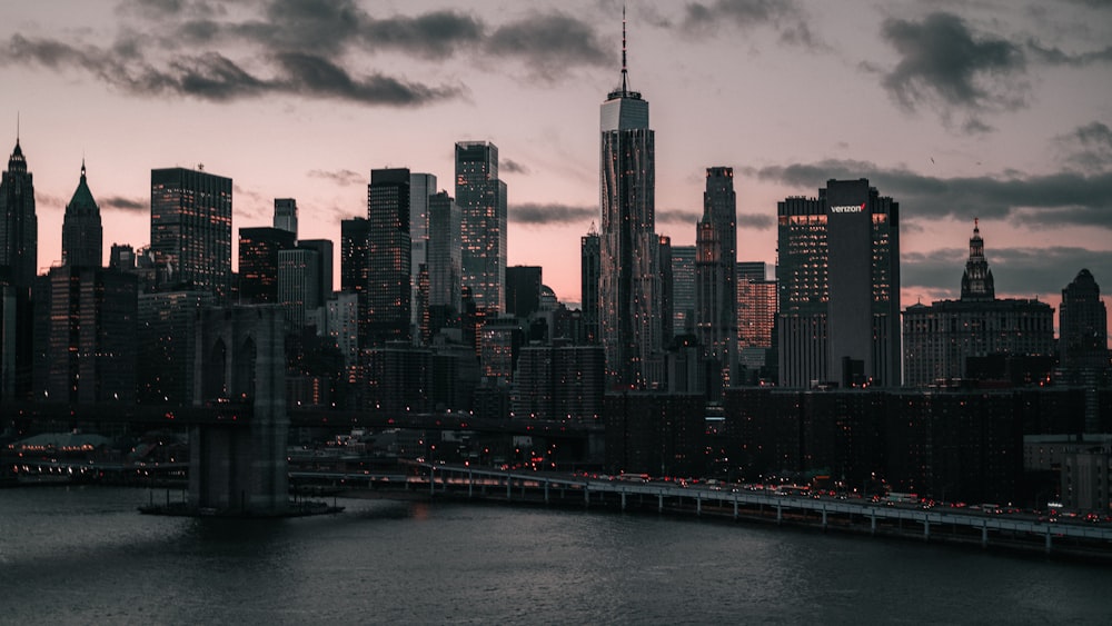 a city skyline with a bridge