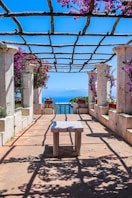 a table and chairs on a walkway
