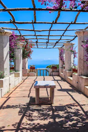 a table and chairs on a walkway