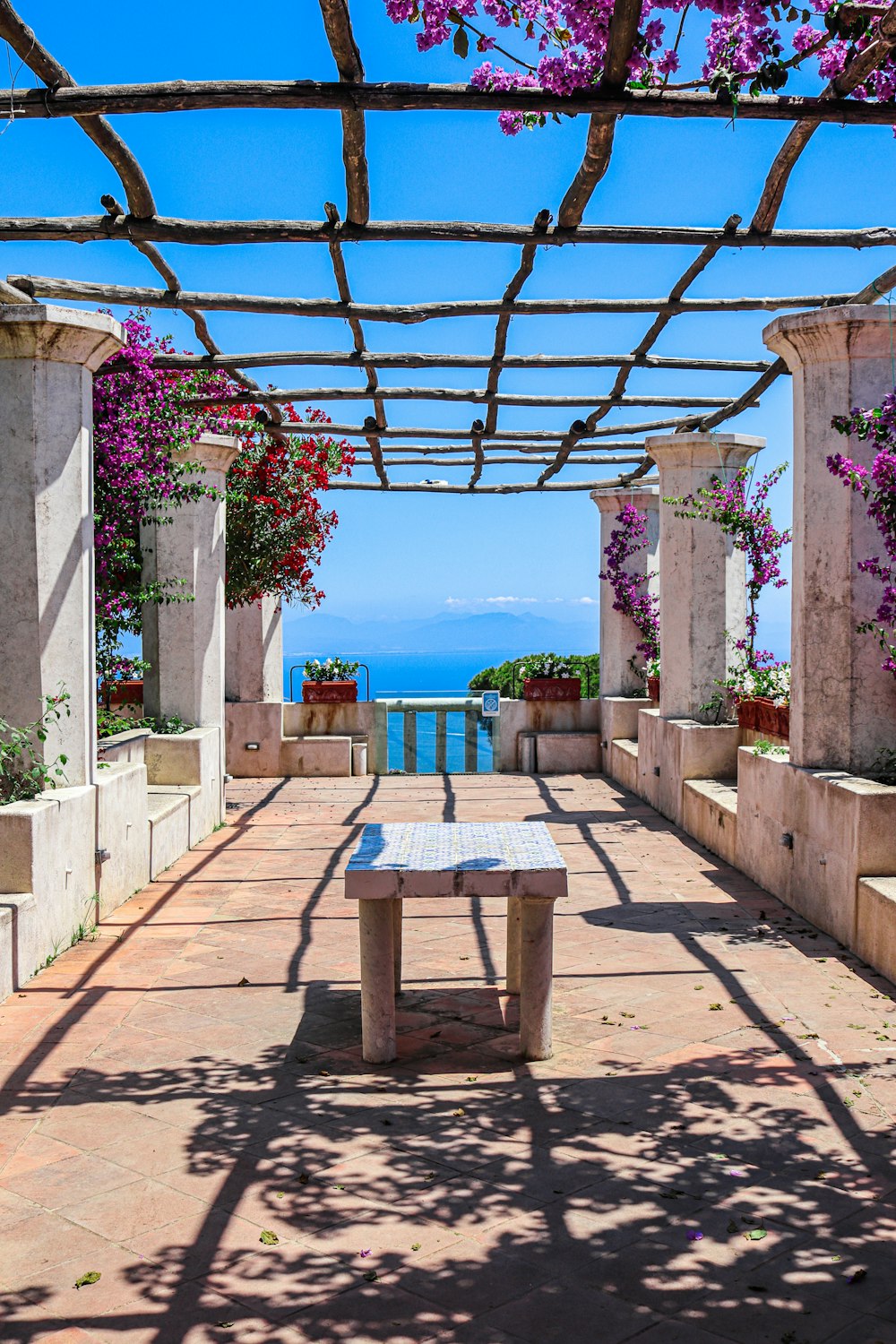 a table and chairs on a walkway