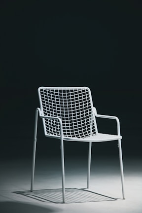 a white chair with a white cushion