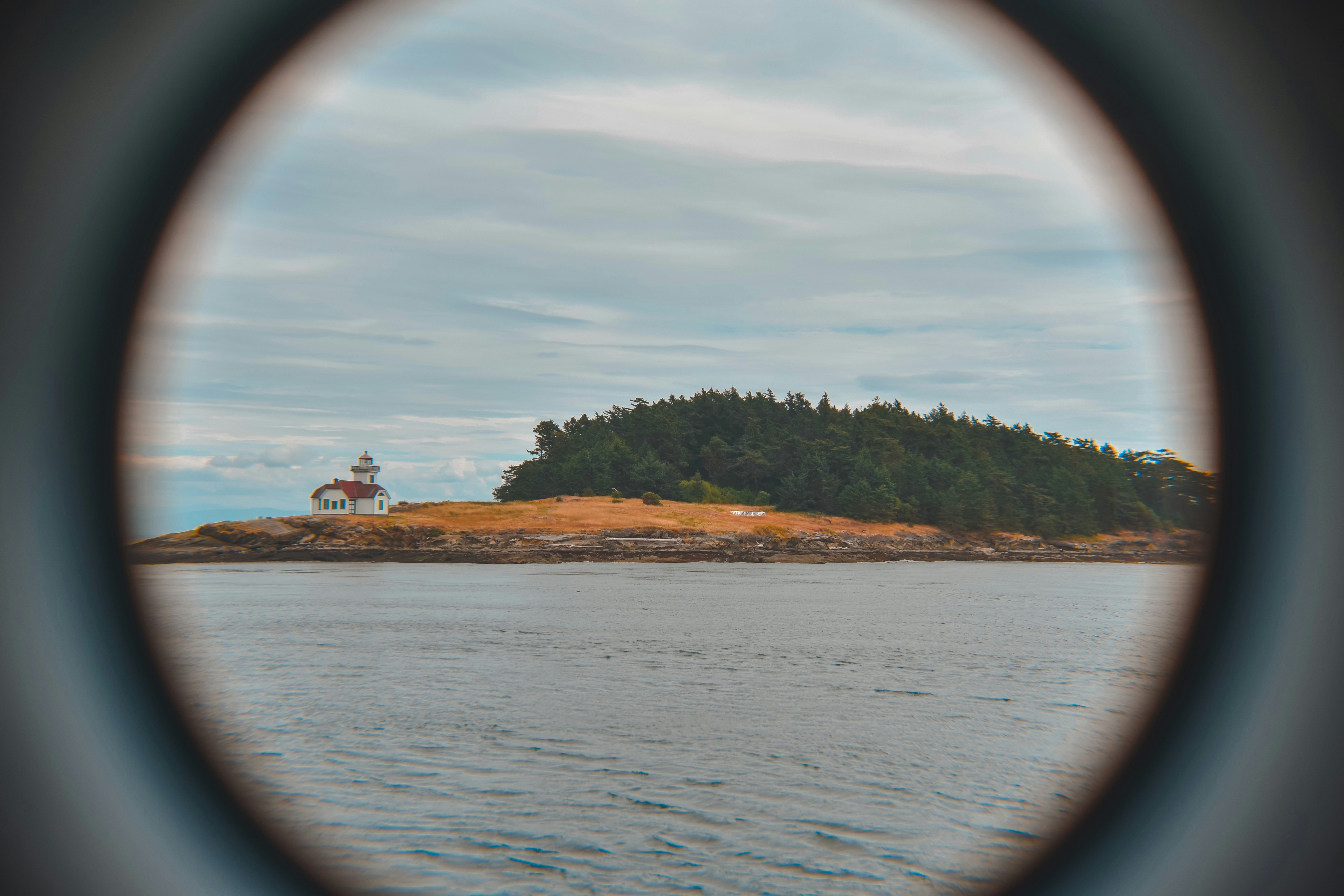 a house on a hill by the water