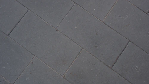 Charcoal split-face slate tile flooring close-up