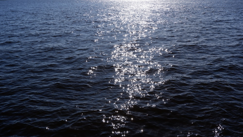 a body of water with water splashing up