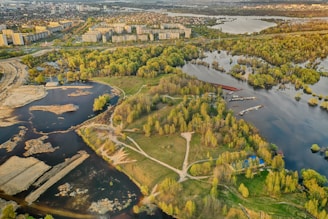 A digital map showing various tokenized land plots including riverfront, forest, and urban areas