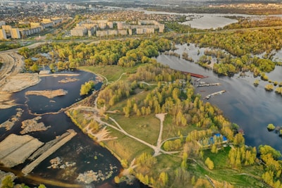 A digital map showing various tokenized land plots including riverfront, forest, and urban areas