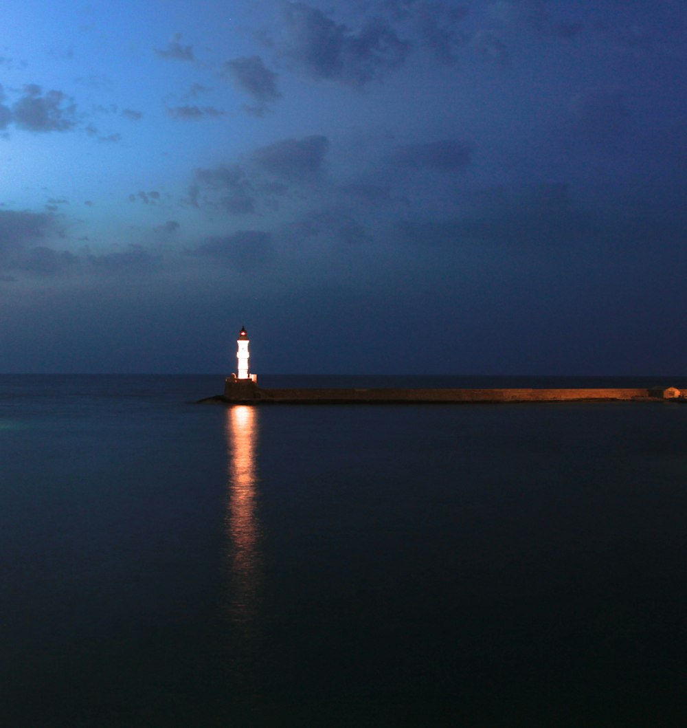 a lighthouse on a pier