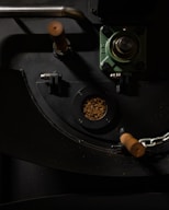 a close-up of a car steering wheel and a small camera