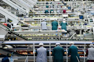 a group of men in a factory