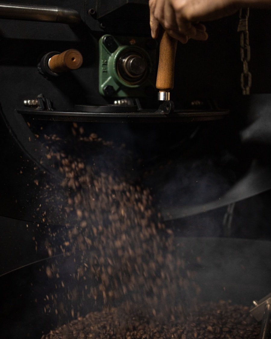 Coffee beans dropping onto the cooling tray from the roaster drum