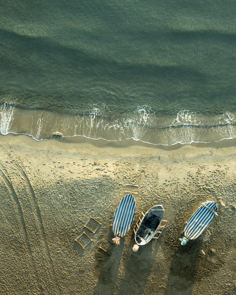 a beach with a few boats