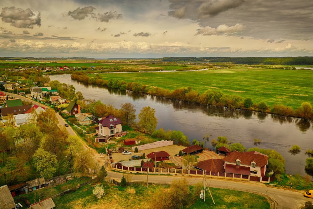 a river with houses and trees