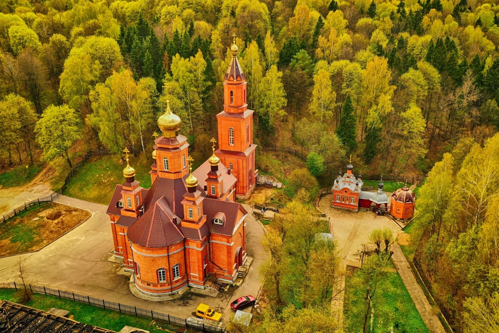 a red building surrounded by trees