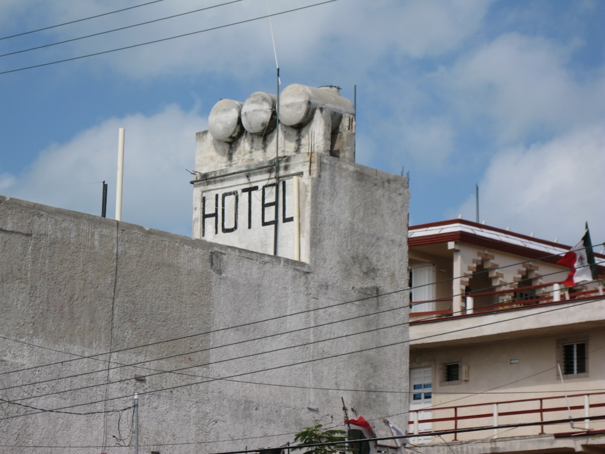 a stone wall with a sign on it
