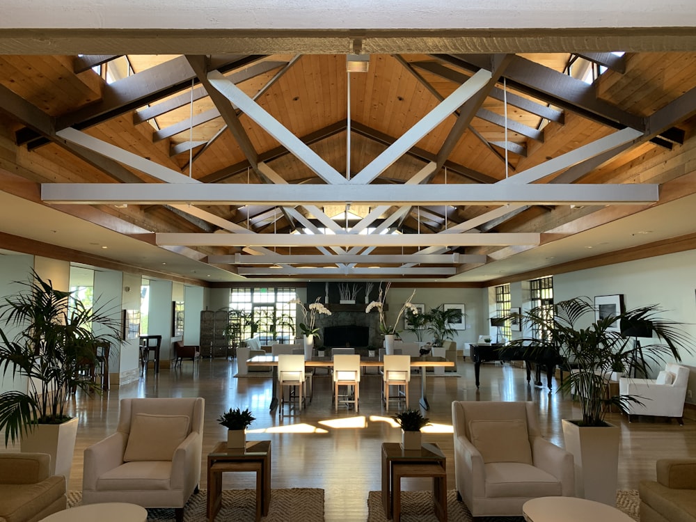 a large room with a large ceiling and many chairs