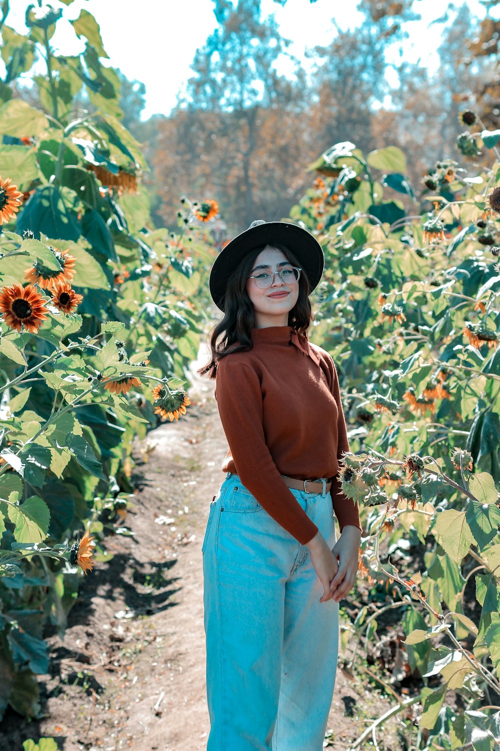 a woman standing in a garden